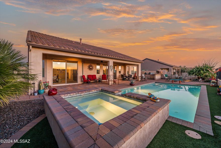 Imagine watching a glorious sunset behind a panoramic mountain view as you enjoy a drink by your lighted, heated pool & spa.  Or getting cozy by a beautiful fire in your great room.  It can be yours today with this lovely Covina model w/casita.  Kitchen has granite countertops w/full backsplash, oversize stainless sink, range hood, convenient desk.  Den/office w/built in desk & cabinets, can convert to optional bedroom.  Primary bed/bath has custom walk in closet & separate makeup vanity area, while large patio door looks out on pool & wonderful mountain views.  Generous covered patio.  Built in BBQ grill & Green Egg. Convenient casita for your guests or hobbies. Extended length garage has epoxy floor, golf cart garage, & work bench.  Add to that all the resort style amenities. Hurry!