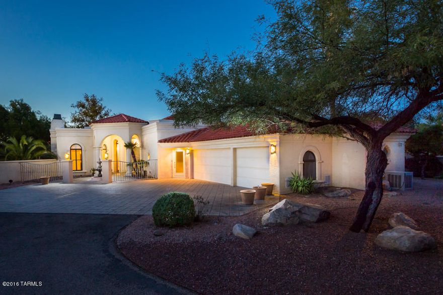 This home is a former ''Parade of Homes'' beauty. Lovely hand-made double copper doors welcome you as you approach the entry. This great home boasts 20' ceilings. Granite countertops in the kitchen, baths & family room bar; three fireplaces; baths all feature tile surrounds in all showers and copper vessel sinks. A cute breakfast area looks out over the spacious patio that boasts golf course views of Tucson National Golf Course and the Catalina Mountains. The pool and spa are there for your relaxation. Huge windows help bring the outdoors into your home and 18'' tile throughout the majority of the home gives it the finishing touch to a lovely, Tucson home. Don't miss the 3-car garage with multiple storage cabinets. Come see it today.