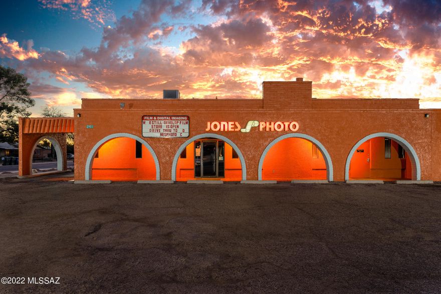 Iconic stand-alone building in the heart of a retail corridor with 10,686 total square feet under roof, 3 tax codes, 4 registered addresses (2901, 2903, 2925, 2927), 55 parking spaces wrapping around the building, & drive-up/thru anchored on the southern lot. This C-1 zoned space has 9,444 SQFT of immediate occupancy available with the anchor tenant requesting to stay (limited financials) in suite E. Suite A, occupied by Jones Photo, is operative with both storage, private bathroom, & limited warehouse space. Suite B has been fully renovated from a prior potential tenant with frontage available, 4 free-flowing partitioned office spaces & 3 enclosed dark rooms adjacent from its own kitchen & 2 bathrooms. Suite C is a general storage space currently with frontage available north of its own  willing to leave & negotiate any or all the equipment currently in A-D suites.

Consider additional income @ market C-1 lease rate of approx. $10/sqft  incredible value add opportunity within a high traffic area (16,336/Day in 2020 survey), .771 of an acre in total (33,584/sqft), grandfathered signage rights, and coveted flexible zoning.