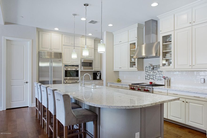 Better than NEW! Ever wanted to buy a new home but have someone else deal with finishes & yard? Someone with impeccable taste? This 2017 built 3890 sqft 4bd/5ba home in sold-out, gated Pinnacle at Center Pointe Vistoso has every upgrade you could ask for:  12' ceilings, extended master, Generation Suite, game room & den. Kitchen has granite counters, upgraded cabinets & tile, Subzero & Wolf  Appliances. Resort-like backyard w/pool, spa, outdoor fireplace, basketball court, artificial turf & low-care landscaping. Wrought iron entry door, hand-scraped hardwood floors, elegant custom built-in's  & gorgeous light fixtures thruout. Community amenities include parks, interconnected trail system & massive community pool/sport park complex. Builder's LivingSmart program means low utility costs.
