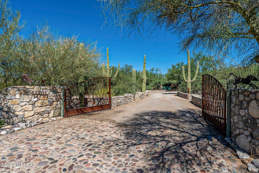 Lovely 3BR/2BA home in the Tanque Verde Valley with huge bonus room and full of Tucson Charm! Sitting on a 1.39 acre lot with mature vegetation and mountain views, this 2459 sqft home is sure to be the perfect setting to create years of great memories, entertaining, and lovely fall mornings having coffee on your stunning covered patios. This home boasts a cozy brick fireplace, picture windows throughout, a split floorplan, granite countertops, recently painted interior, large storage shed AND a huge workshop! Other great features include a water filtration system, newer HVAC, and rainwater collection system with a capacity of 3,000 gallons. Call for your private showing today!