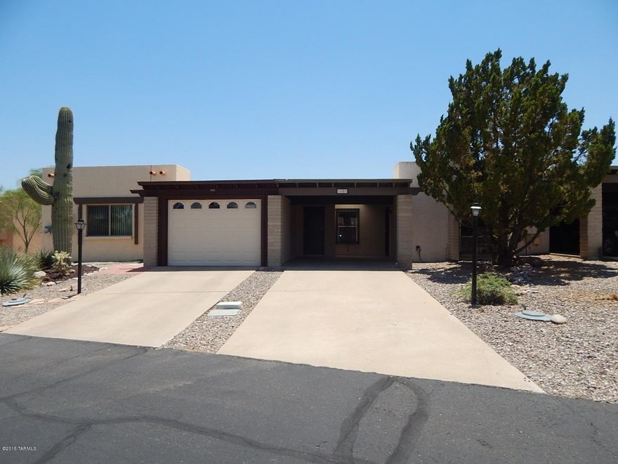This is a Fannie Mae HomePath property! With 1027 sq ft of living space this townhome has 2 bedrooms, 2 bathrooms, 1 carport, & Arizona Room with great mountain views. No rear neighbor for added privacy. <FONT COLOR=RED> Recently painted interior with two tone paint, installed NEW carpet, NEW oven/stove, & NEW microwave. </FONT>Located in Green Valley Desert Hills subdivison, close to I-19, shopping, restaurants, & much more! First Time Buyers, complete the HomePath Ready Buyer homeownership course. Attach certificate to offer and request up to 3% closing cost assistance. Ask Listing Agent for more details. Restrictions apply.