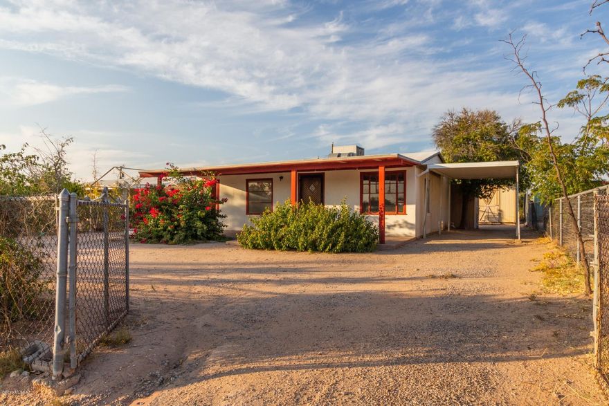 Very charming home available on a large N/S facing lot in a quiet south Tucson neighborhood. Convenient location, just a stones throw from the I-19 and within easy walking distance of shopping and restaurants. You will love the covered front patio which extends the entire length of the house, a great place to relax and enjoy the desert breeze. Inside you will find a spacious living area with low maintenance tile floors and a cozy fireplace, ideal for cold desert nights. Bedrooms are bright and inviting with plenty of room for sleep, study or storage. Sprawling backyard includes 2 large storage sheds and is a perfect spot for pets to roam or a garden to grow. This gem is offered at an excellent value and will sell fast. Owner is licensed to sell in Arizona.