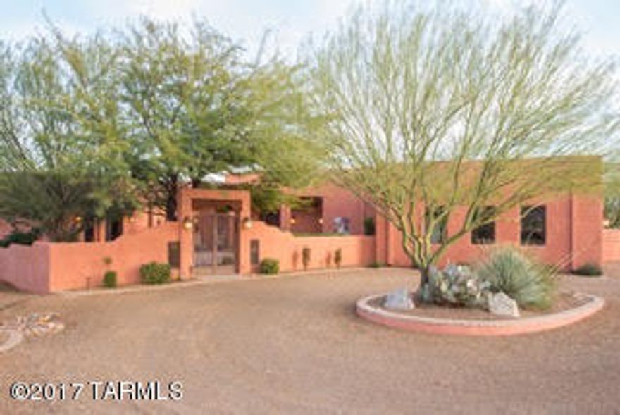 Enjoy sumptuous surroundings in this splendid, custom home located in the desirable Madera Shadows Neighborhood.  A private setback from the road offers privacy and impressive sweeping views of the desert valley and a magnificent vista of the Santa Rita Mountains.  Located on 2.36 acres, this 3,739-square foot home including a 602 sq.ft. guest house is completely custom from the ground up.
Situated to enjoy breathtaking views from inside and out.  Bask in the sun from your patio or luxuriate by the pool or in the hot tub.  Entertain friends and barbeque from your outdoor kitchenette while watching another smashing sunset.  The open living areas boast large windows framing stately views from nearly every room.