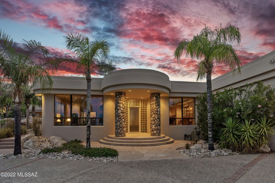 Live the Tucson lifestyle!  Location, location, location.  This incredible ridge side soft contemporary with its own private gate has it all.  Views from every room!  Security!  Privacy! Tucson Rolling Shutters on all windows and glass sliding doors. Any chef would love this modern kitchen with 2 sub-zero column refrigerator/freezers and wine cooler.  Bosch dishwasher, Wolf induction cooktop, pop-up vent, built in double ovens and convection microwave.  Expansive formal dining room perfect for family gatherings.  Spacious owner's suite with dual bath areas and walk-in closets.  Incredibly large rec room suitable for multi-use such as pool room, gym, media room, or even mother-in-law's suite.  Possibilities are endless. Entertain your guests on the covered patio at the beverage bar with seating for 10. Must see to believe this luxurious resort style back yard. Cimarron's 24 Hour Security Patrol included in HOA fees. Pride of ownership shows from start to finish!
Owner is a licensed AZRE broker.