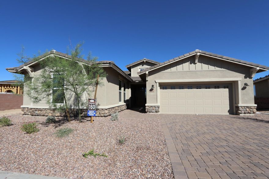 Craftsman style Panorama plan is Move-in ready today! This beautiful floorplan offers open greatroom living area with 3 Bedrooms & Dining room.  Gourmet kitchen features upgraded, staggered cabinets w LED underlite, granite counters, tiled backsplash, stainless steel appliances, & oven w/microwave combo. The master retreat boasts bay window, extended walk-in closet, granite vanity and tiled walk-in shower with spa niche. Other upgrades include: pavered front porch, 8' doors throughout, 12x24 tiling, ceiling fan outlet on patio, recessed lighting, gas BBQ stub, two-tone paint and more!
