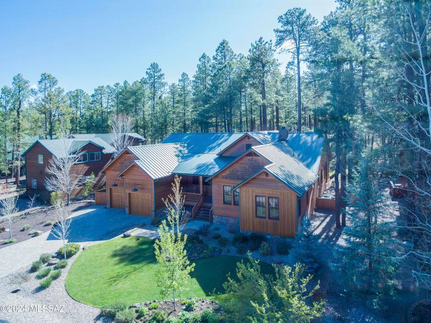 Bordering National Forest in the exclusive gated community of Starwood Estates, this meticulously designed single level custom built home awaits you. Enter the Great Room, past the walk-up wine bar, you are drawn to the serenity of the Forest seen through the wall of windows. Included are Aspen Tongue and Groove vaulted ceilings and hand scraped hardwood flooring. Stepping through the twelve foot doors to the back deck, entertainment awaits you with a gas fireplace and natural gas outlets for two grills. Adjoining the Great Room is the Gourmet Kitchen complete with ceiling height knotty alder cabinets, Wolf Gas cooktop, separate prep sink and wine refrigerator appointed around the cook's island topped with a single slab of Sandalus quartzite. There is a generous multipurpose room with laundry, sewing desk and craft tables along with a freezer and pantry space. Three bedroom, three bath home with an office (could be a 4th bedroom), two of the bedrooms are en-suites with gas fireplaces and provide access to the back deck where you can enjoy your morning coffee looking out over the forest. The Guest en-has an infrared sauna for you to indulge after outdoor activities. Knotty Alder shutters provide privacy throughout. Paver Driveway with an almost 700 square foot two car garage which includes a workshop area. Amenities include on-demand tankless water heater with recirculating pump, two gas pack heaters and A/C units, 22KW Generac natural gas generator w/automatic switching. A serene retreat with the highest quality finishes and unparalleled natural beauty. Listing Agent must accompany all showings.