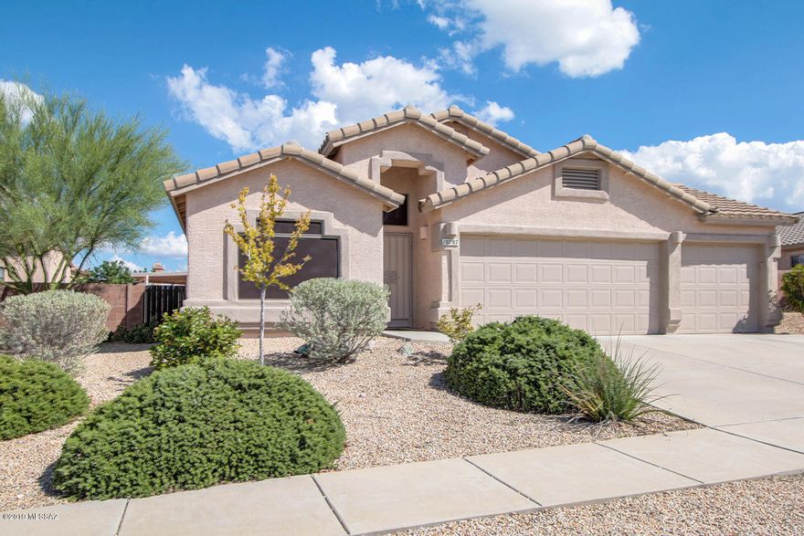 Incredible opportunity to own a wonderful home on a large lot within walking distance to the wonderful Vail schools.  This home offers all the amenities which appeal to each family member.  Four bedrooms, 3 car garage, open kitchen, huge yard with extended covered patio,  flagstone seating area, mountain views, and additional space in the yard to let your imagination take over.  This is a one owner home with true pride of ownership.  Truly a must see!!! Seller shall accept or counter offers from $250k- $255k.