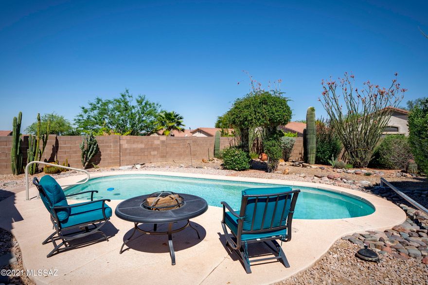Enjoy this well-maintained home in the desirable Villages at Dove Mountain! As you walk in, be greeted by the spacious great room with gas fireplace that opens up to the kitchen and dining area. The kitchen is designed for a chef at heart with plenty of counter space, black appliances, pantry and freshly painted cabinetry. The master retreat features a walk-in closet, soaking tub, and separate shower. 2 additional guest bedrooms are sequestered on the south end of the home with another full bath and an additional bedroom/den/flex space off the great room. Relax under the expansive covered patio and walk out on the flagstone to soak up the sun in the large pool. The community offers a large park, tennis courts, dog parks and numerous hiking trails.