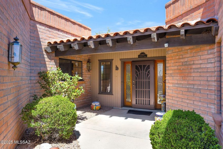 Located on the hilltop in Sunrise Mountain Ridge. This detached, ridge top home has sweeping mountain views. Come feel the difference in the spacious Mazatlan floor plan with 2480 sqft. Large living areas make for great flow. There is a traditional bee hive fireplace. The third bedroom can serve as an office or den with Murphy Bed. This space allows for a guest room, a home office or a way to isolate your hobbies or crafting. The easy care yard has an extended brick paver patio that adds to the outdoor living space. Winter in Tucson is the BEST!
