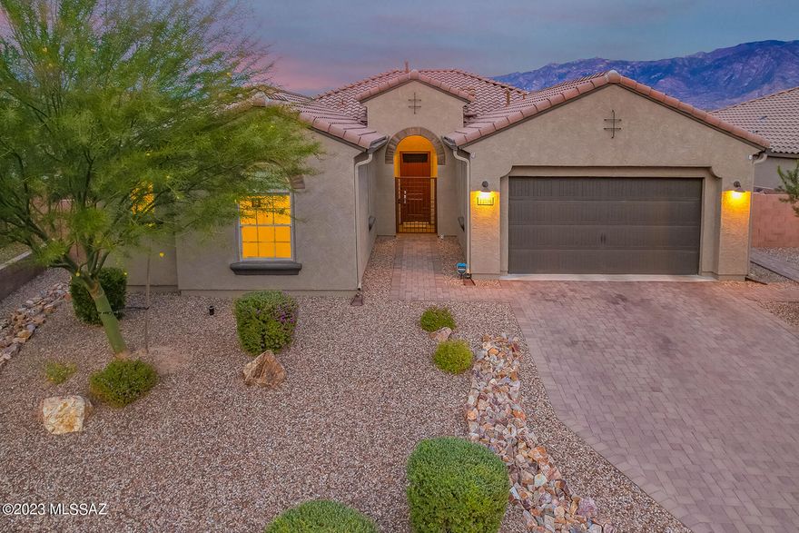 Panoramic Catalina Mountain Views!  This highly upgraded, east facing 3BD/2.5BA + Den (2,346 SqFt)  home back up to natural land to maximize the view & privacy. No neighbors behind! Seller owned solar. Open concept floorplan, custom paint & tile floors throughout (no carpet).  Gourmet kitchen hosts a large island, SS appliances, walk-in pantry, breakfast bar and dining area. Luxurious Owner's Suite boasts Bay Windows to capture the views, patio access, dual sinks vanity, large walk-in shower and closet.  Spacious Guest Rooms with Jack-n-Jill bathroom. Office/Den can serve as 4BD.  Enjoy the unobstructed mountain view in the private backyard with covered/uncovered patios, built in BBQ, firepit, & turf.  Oversized lot with plenty of room to add a pool. A must see. Views!