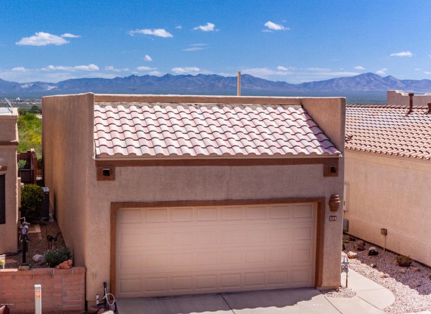 Spectacular Panoramic Mountain Views greet you the moment you step into this freestanding home in a very private setting. Many recent updates including  exterior and interior painting throughout, new Corian Countertops, new kitchen faucet, disposal, dishwasher, Refrigerator, lighting, water filter system & Ceiling fans. New low maintenance  landscaping in front and backyards. Roof re-coated in 2017 and new HVAC & Water heater in 2016. Storage cabinets in great room and garage.  NO GVR but is available if a buyer chooses.  You'll love this magnificent Green Valley home and setting, and just a very short walk to the pool.