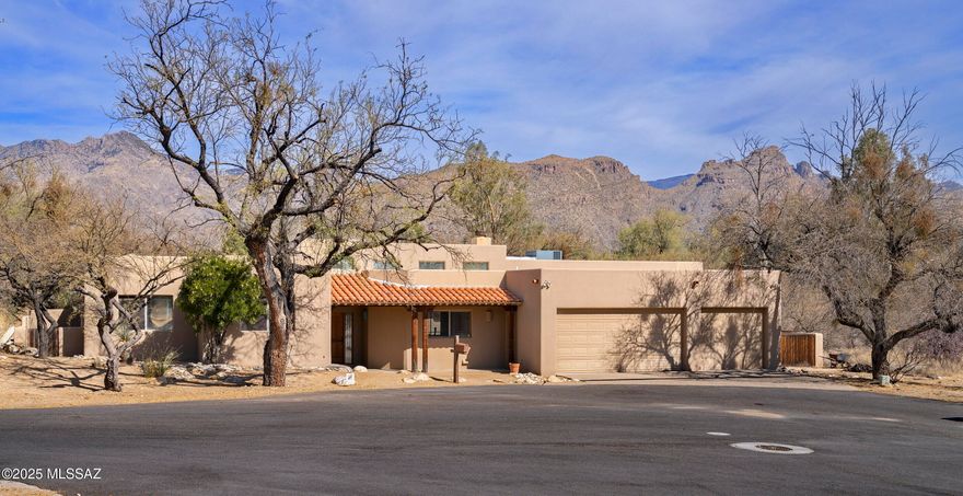 Located in pristine Hidden Valley, close to Sabino canyon, this beautiful and  private 4BR/3BA home featuring a split bedroom plan is situated at the end of a culdesac. Open floor plan with a stunning great room with high ceilings and fireplace. Spacious dining area has built in cabinetry with bar, sink and wine fridge. Great Room opens to kitchen which is at the center of the home with eat at island counter with second sink, a walk in pantry and lots of cabinet space.Beautiful backyard w panoramic mountain views is perfect for entertaining, begins with screened outdoor patio that opens to magnificent pool and spa. Lovely Primary Suite has a separate sitting area, large enough to use as a study or library. Primary bath features double vanity and separate tub and shower. The 3 guest rooms