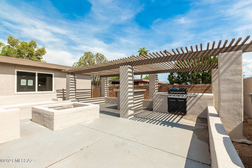 Beautifully updated home with 3 bedrooms and 2 bathrooms is the one you're looking for! Lots of parking space, built-in BBQ, firepit, and sitting area under a lovely pergola greet you at the front. Discover a pleasing interior with abundant natural light, neutral palette, tile flooring, and spacious living areas. Immaculately upgraded kitchen offers a plethora of white shaker cabinetry, SS appliances, and handsome countertops. Plush carpet and ceiling fans in all the bedrooms! Huge main suite has a private bathroom w/dual sinks & shower w/built-in seat. Sizable backyard is a blank canvas waiting on the new owner's touch. Make this gem yours.
