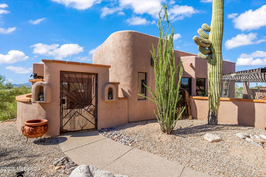 Welcome to 30 W. Stone Loop, a bright and lofty ridge-top home offering unparalleled sunrise and sunset views over Tucson.  Nestled on nearly 2 acres at the base of the Santa Catalina Foothills, 3 bedroom/3 baths,this home boasts an open-concept design with soaring ceilings and abundant natural light.  The gourmet kitchen is a chef's dream, complete with a professional Viking stove for culinary excellence.  The expansive patio is perfect for entertaining, relaxing or simply soaking in the breathtaking mountain views.  A private guest house adds extra flexibility-ideal for visitors, office, or rental potential.  Conveniently located near essential amenities, including a gas station, and shopping at the nearby mall.  this house offers both privacy and accessibility.