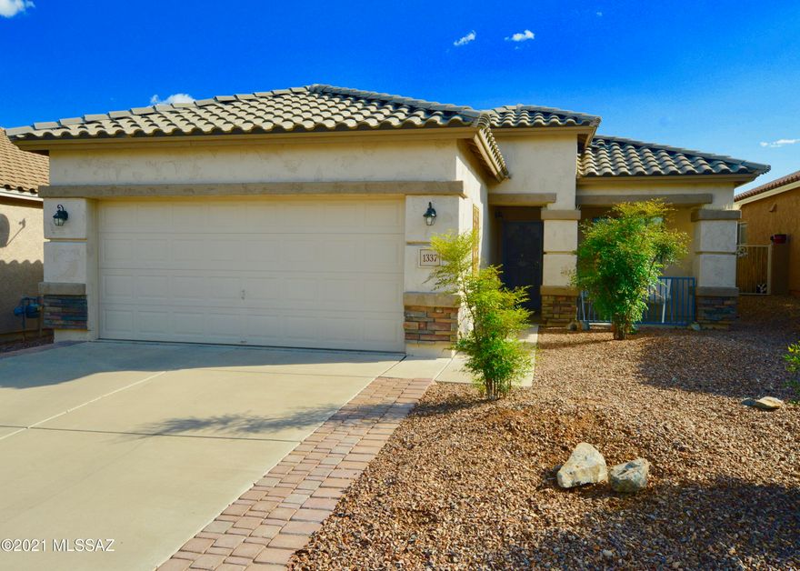 WOW! This 2 bed + den home in gated Rancho Resort is right out of the magazine.  Pride of ownership delivers a meticulously cared for upgraded home. 
Gorgeous new black ss appliances and grey marbled solid surface counters open to a spacious living room. The backyard is an absolute oasis with covered patio, saguaros, artificial turf and privacy. This is the home you have been waiting for - it is beautiful, has so much new, is conveniently located and well cared for!