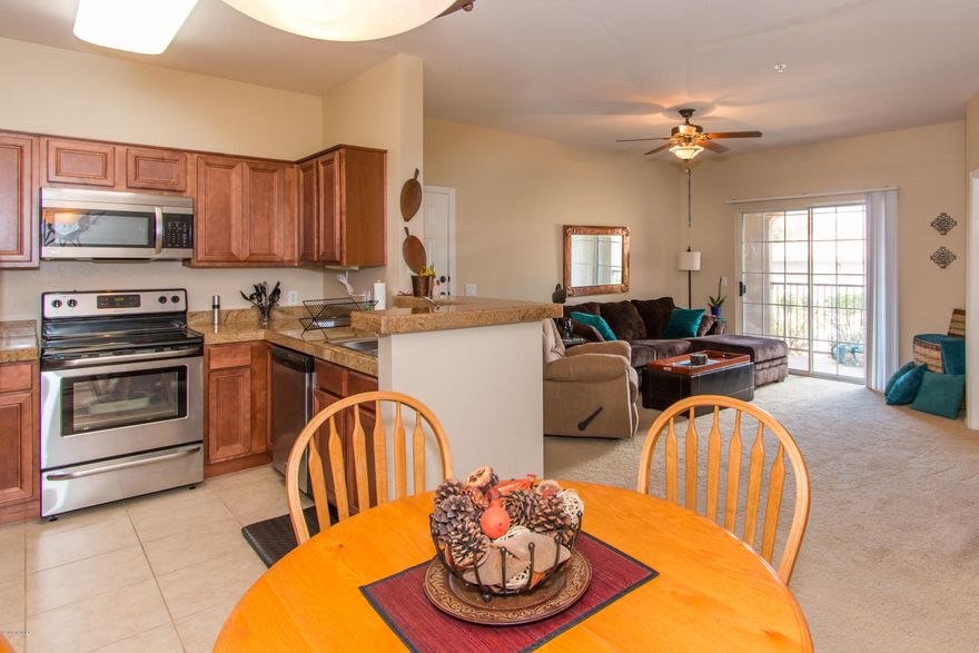 Seller will accept or counter offers between $124,900-$129,900. 1st floor condo. Nestled up to the Catalina Mt's. Open floor plan, dining area & bar. Up graded cabinets. Ceramic tile, Granite counter tops. Ceiling fans, Bathroom has two sinks. American Home Shield offered. Unit located away from traffic area. Conveniently located. 1 mile to the Oro Valley Marketplace, Century Theaters, OV Hospital, medical facilities, grocery shopping, golf, resorts, shops, restaurants, hiking, bicycling and more. Most furniture may be purchased with separate bill of sale for furnished rental, vacation home or live here year round. Make offer. All appliances included. Heated pool & spa. Fitness center includes 2 rooms, business center, clubhouse to host parties.