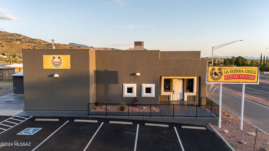 Incredible opportunity to own a locally treasured culinary location at the foot of the mountains. Completely rebuilt in 2012. High visibility on main highway. Building features an extensive kitchen, bar area, banquet room, and ample seating. There are 5 parcels included in the listing. (104-06-002E/104-06-002C/104-06-007/104-06-017/104-06-002a) . A premier dining destination for over 50 years within the local community. Its expansive layout, well-appointed kitchen, and idyllic surroundings, just minutes from Sierra Vista make it an enticing investment opportunity for discerning buyers. Class 12 liquor license included in sale.