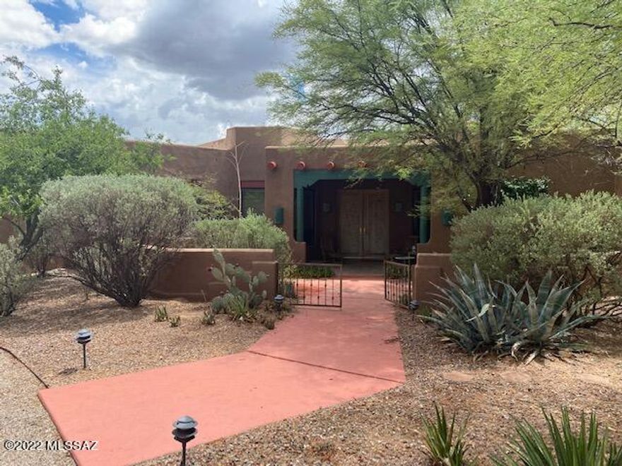 Beautiful courtyard entry, 4BR/3BA Santa Fe, 3205 sq. ft. on almost 1 acre lot in Powder Horn Ranch gated community with circular drive. High ceilings, 3 fireplaces including 1 Beehive in Master Bedroom, 1 outside FP on patio. Large. kitchen with huge Granite counters and island. Split bedroom plan, 1 bedroom with double doors adjacent to foyer entry used as office. Tile floors with carpeted bedrooms, large windows, 2 car garage, exceptionally beautiful back and front yard landscaping. Circular drive and awesome Western style wood gates leading to back yard, multiple patio areas, 8ft. double entry doors! One neighbor adjacent to property may board horses if you have any.
This home has so much character with NEW Vigas and beamed ceilings with Ocotillo lattice between Beams in Family Room.