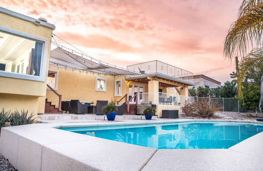 An Urban Dweller's Dream Home tucked in the Tucson Mtn. Foothills! Here's the updated/unequaled Contemporary flex-plan home you so desire! It checks your list- 4Beds/4 full Baths, split plan, Pool,warm/rustic Wood Ceilings, 2 Car ext. length Garage w/Work room, additional Workshop, Guest Quarters, Dog Run, Rv Space, No HOA, Ample Patios, View Deck, Epic City& or Mountain Views from all angles- all in a quiet, safe neighborhood in a serene desert setting just minutes from I-10! The details- Grand Master suite w/gas FP, expansive Bay window facing City/Mtn Views, Spa-like MBath, Walk-in closet, Sliding doors to Patio/Pool. Flex-plan offers Dining room, Kitchen w/Custom cabinets, Corian, Butcher's Block, Bfast Bar. Airy Great Room w/wood FP and French doors to Travertine Patio & Superb Pool.. Warm/Private Backyard w/Epic City/Mountain Views,Sun Shades, Edison String Lights, Viewing Deck offers Panoramic Views! 35x18Ft Pool w/self-cleaning jets. Two Spacious Bedrooms each with private/hall Full Baths, Cedar-lined Deep Closets. 4th Bedroom w/private entrance on driveway side, Full bath, seating area and space to add a kitchenette makes this the perfect Multi generational In-law Quarters, Guest Quarters or AirBNB/rental opportunity. Ext. length Garage has epoxy floors and Work room. Separate Workshop offers ample space for all your projects, 4' crawl space for add. storage, Laundry room w/matching kitchen cabinets. This is a Charming and functional home in an unbeatable location!Corner lot & street ends in cul-d-sac!  Easy access to I-10, UofA, DM, Downtown, Raytheon, Caterpillar, Amazon, Airport, Shopping, Hospitals. Wildlife and great hiking/biking included. You better hurry!!