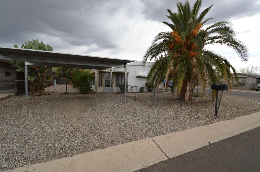 Come see this well-maintained mobile home! Affordable, comfortable, and on large desirable corner lot! Large AZ room and covered patio great for entertaining guests! Fenced yard perfect for kids or approved pets! YOU'VE GOT TO SEE THIS ONE! Don't wait on this one! CALL for your appointment TODAY!