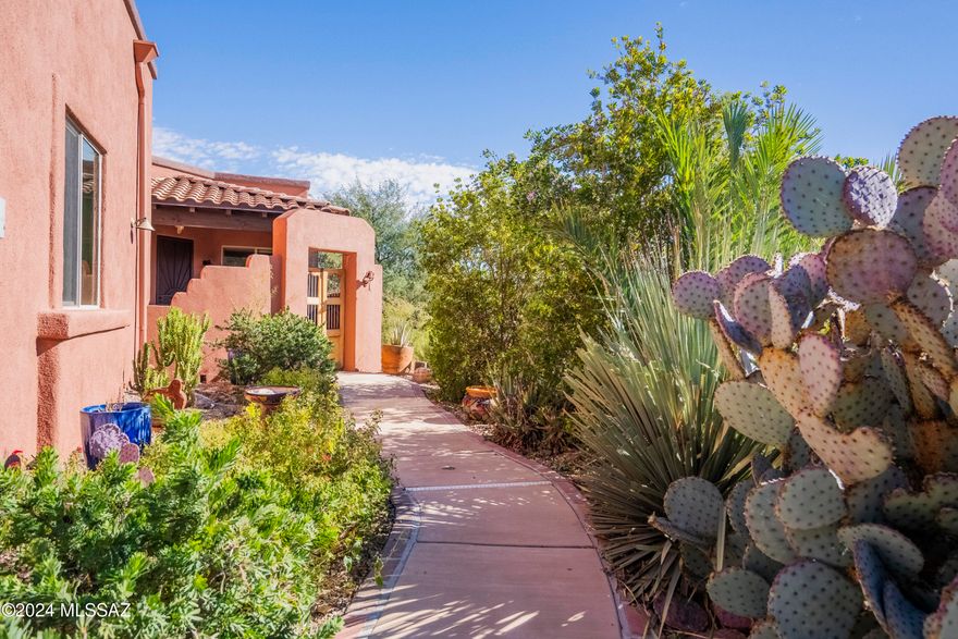 Nestled in the serene and desirable community of the Barrio de Tubac, this stunning 1,842 sq. ft. single-family home offers a perfect blend of comfort, style, and natural beauty. With incredible mountain views from nearly every room! The spacious open floor plan features a bright and inviting great room with large windows that frame the stunning mountain vistas. Enjoy morning coffee or evening sunsets from the patio with a built-in fireplace and picturesque mountain views over the horizon of cottonwood and willow forest below. This home's prime location provides access to the scenic Anza Trail, ideal for hiking or outdoor exploration. The property is beautifully landscaped with a picturesque walkway lined with trees and flowers, adding to the charm and curb appeal. SEE MORE... The extended garage offers plenty of space for your vehicles/RV and additional storage. This home is an exceptional opportunity for those seeking a peaceful lifestyle in a scenic, welcoming community. Start living the Tubac lifestyle