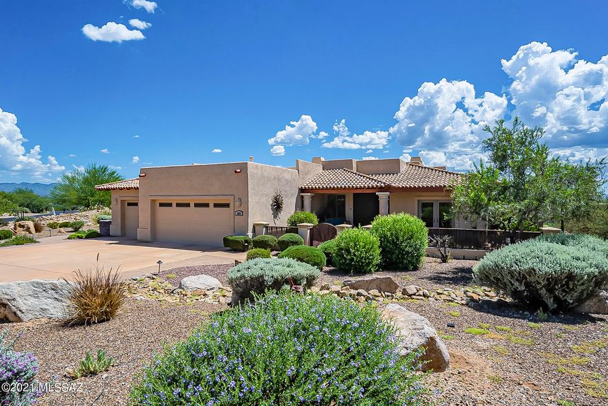 This stunning home located in the exclusive Alamos Estates in the heart of Green Valley will surely excite the most discerning buyer.  As you walk in you are immediately welcomed by the beautifully appointed great room with Cantera columns, high ceilings and perfectly framed mountain views. The gourmet kitchen features custom cabinetry, granite counters, gas stovetop and stainless-steel appliances. The formal dining area is perfect for entertaining or family meals.  The master suite with soaring mountain views features a fireplace, dual vanities, walk-in shower, and large walk-in closet.  Two sizable guest rooms and a guest bath compliment the rest of the home.  Step out to the backyard to take in the panoramic mountain views or a dip into the pool and hot tub.