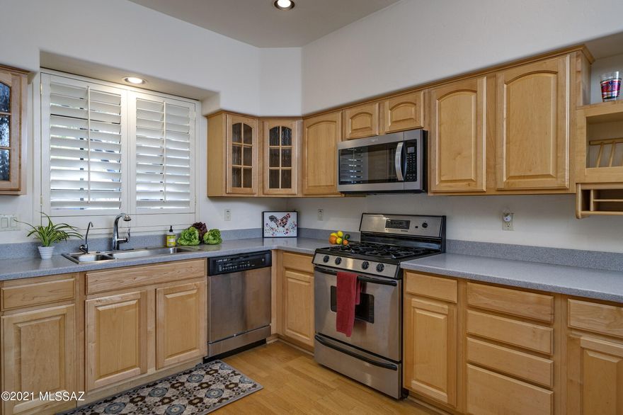 Seller will accept or counter offers between $450,000-$475,000.  Sam Hughes gem!  Two primary bedrooms with private bathrooms located on the 2nd floor.  Access to balcony from both rooms. Living space on ground floor is an open concept.  Beautiful and modern.  Great floor plan provides an open feeling with tall ceilings. Kitchen has stainless steel appliances. Newer water softener.   Laundry and half bath located on ground floor.  Located 2 blocks east of the U of A!  Two street parking passes and one guest parking available by permit.  Front court yard has large trees and is fenced.  Back has zero lot line for low maintenance.  No needed updates to the mechanicals!  Roof recoated.  A/C replaced 2 years ago.  Appliances stay. Turn key.. truly move in ready!