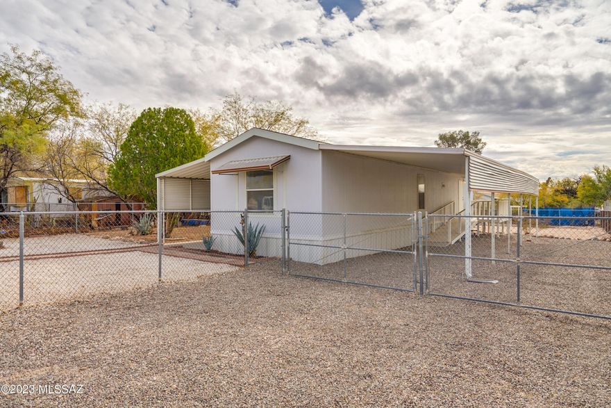 Centrally located. Great lot size - 1/5 of an acre, fully fenced, well-kept clean home with neighbors who look out for each other. 2004 Fleetwood 65635 MH home ''Silver Ridge'' series, single-wide, 6-axles affixed - original owner bought new in 2003 and moved onto lot. Split bedroom layout; both bedrooms have their own bathroom. Ramps on both sides, no steps. This is an estate sale - AS IS. Priced for quick sale.