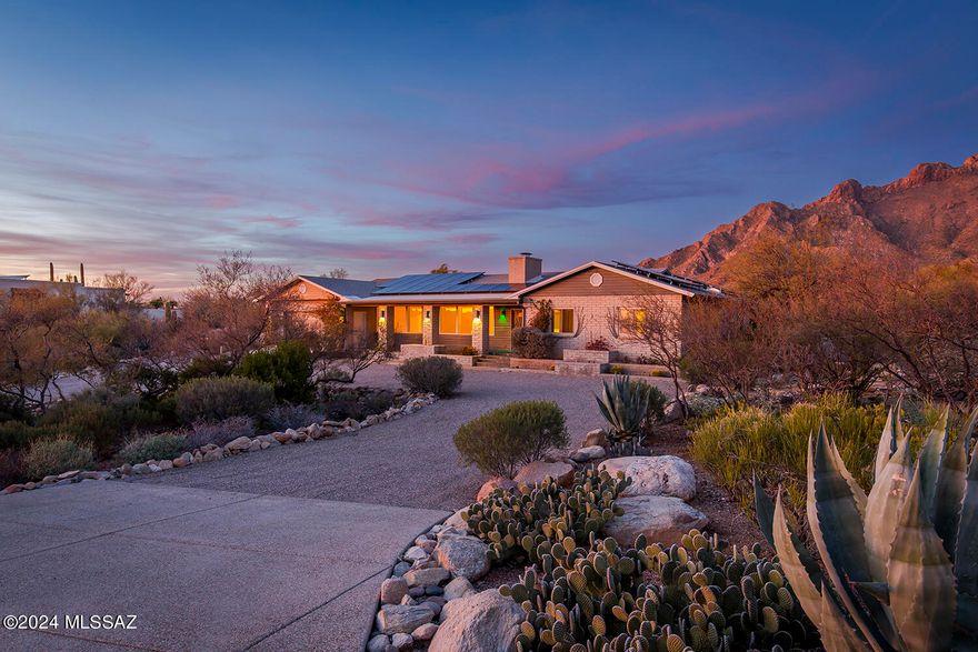 SELLER OFFERING $10K toward Interest Rate Buy Down or Updates! Nestled at the Top of the Hill near Pima Canyon, is this Perfectly Sited .83 Acre Desert Dweller's Dream Home with Solar + Rain Water Harvesting. Front Porch w/Sunset & City Light Views! Entertain in Style in the North Facing Backyard w/Pool + Incredible Mountain Views, backs to the Southern Boundary of Pima Canyon. Enjoy Spacious Family Living w/Formal Living Room/Dining Room, Wood Beamed Ceilings, Fireplace, + Picture Windows. Large Cook's Kitchen w/Granite Island, Breakfast Bar, Walk-In Pantry, + Maple Cabinets w/Pull Outs. Family Room w/Wood Beamed Ceilings + Built in Entertainment Center. Split BR Plan w/2nd Primary Suite-Perfect for In-Laws/Extended Family. Remodeled Primary Bath. Lot Offers Buildable Space for a Casita. The Remodeled Primary Bath Offers a Walk-in Shower with two Shower Heads and Bench, Dual Vanities with Granite Countertops, Updated Lighting (including under cabinet night lights). 

The Home Offers great Natural Light with Triple Pane Windows and Beautiful Plantation Shutters, as well as Custom Wrought Iron Security Doors. 

You and your family will Treasure this Wonderful Property, offering magnificent Mountain, City, Sunrise, and Sunset views! Numerous Functional Outdoor spaces, including the Front Porch, as well as several shaded Entertainment areas, and a Peaceful Water Feature in the Backyard. Enjoy an Extended Flagstone Look Covered Patio, offering shaded Mountain Views, and Lots of Spaces to Sun Poolside! (Pool Pump was recently replaced).

Ultra Convenient Foothills Location with Numerous Grocery Stores and Restaurants within a 5 minute drive. Nearby Hiking Trails include Pima Canyon, Finger Rock Trailhead, and Catalina State Park. Great Area Golfing (La Paloma, El Conquistador, Skyline Country Club, and Ventana Canyon). Numerous Nearby Resorts and Shopping areas: La Encantada and Casas Adobes Plaza are all within a short drive. 

Wildlife abounds in this Community. You will find Bobcats, Deer, Javelina, Coyotes, Rabbits, Roadrunners, Cardinals, Screech Owls, and Cooper Hawks. 

This home epitomizes the Catalina Foothills Lifestyle. First Time on the Market in 30 years. Recently Reduced Price- Come Check it Out!