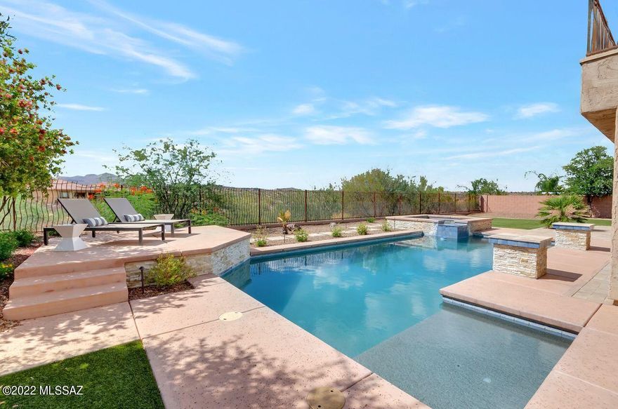 Spectacular 4BD/4BA, 3,807 SF, 3 car garage on 1/3 acre lot in Gated Hohokam Mesa Estates in desirable Rancho Vistoso area of Oro Valley. Stunning open floor plan with huge great room, tile floors, Gourmet kitchen w/ large island & gas stove, granite countertops, walk-in pantry, pocket office, formal dining room, w/ a separate den & powder room. Second floor features large media room, 4BD with 3BA (one is Jack & Jill style) and laundry room. Elegant Master Suite with balcony, 2 walk-in closets, soaking tub, dual vanities, sep shower & exercise rm/office. NO HOME BEHIND. Extended covered patio with built-in BBQ kitchen & bar overlooks beautiful resort like yard with hardscape and artificial turf, pebble Tec pool & spa (in-floor cleaning system). Sunset/mtn Views.