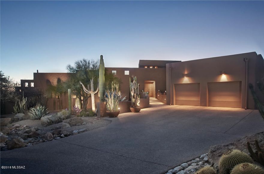 Beautiful Southwest Contemporary ideally located at end of the cul de sac on a very private 2+ acre lot bordering the mountain course at Ventana CC - a private sanctuary filled with specimen cacti. This home offers dramatic entry,living room with high beamed & planked ceilings, exposed split-face block walls, corner fireplaces and walls of windows overlooking the wrap around deck,the lush desert and golf course. Spacious Kitchen/family rm with granite counter tops,gas cooktop, fireplace and private patio with views of the mountains.Split bedrooms with expansive Master bedroom suite with sitting area, double vanities, spa tub and 2 walk in closets. 2 additional large bedrooms with en suite full baths .2 car garage plus golf cart entry and parking completes this sophisticated home.