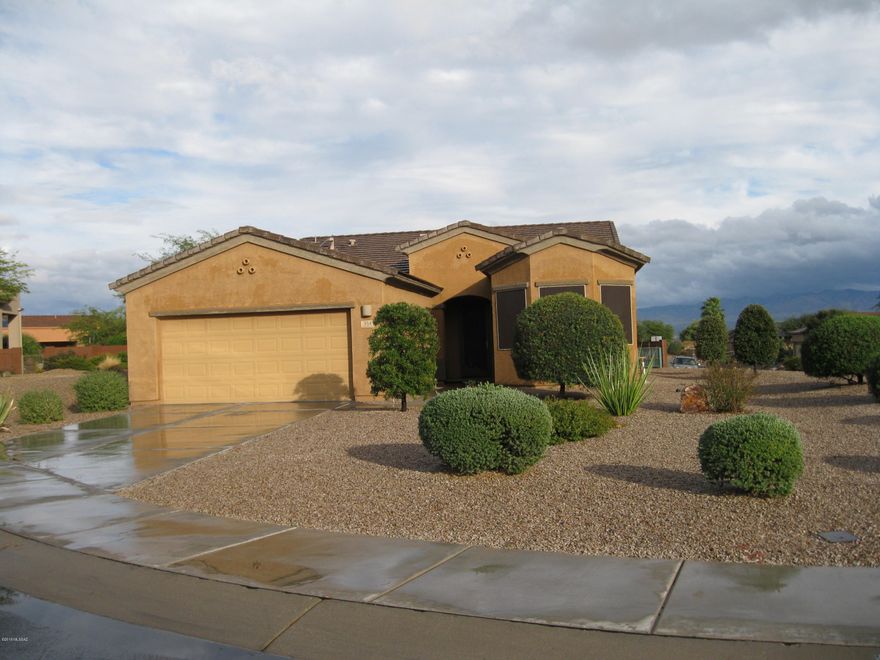 Enjoy the open floorplan in this beautiful Las Campanas home located in the San Miguel section.  Tile in all areas except two bedrooms which have thick upgraded carpet.  Darker kitchen cabinets make this kitchen rich looking and top that off with granite counters and stainless appliances.  This beautiful home is located on a cul-de-sac and has a very spacious corner lot with attractive landscaping.  Enjoy the large covered back patio area and mountain view.  Solar lease in place provides low electric bills.  Come see for yourself.
