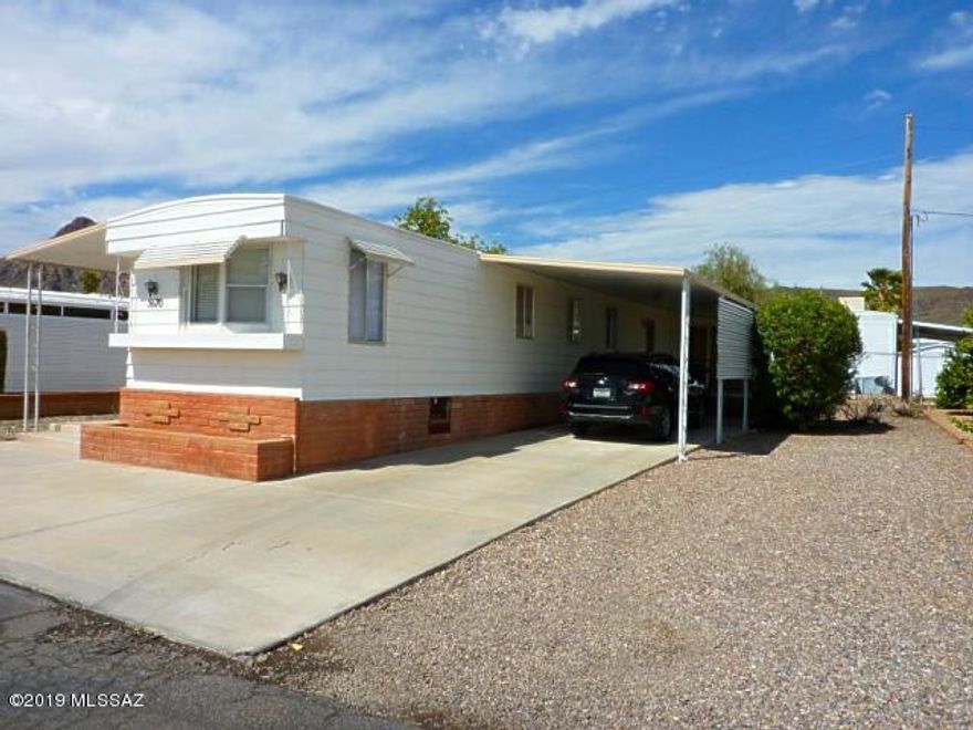 55+ Community of Tucson Estates. Great home for seasonal, rental or year around. 2bdrm/2Ba, Lg screened West side porch. Lg East-side Porch with Mountain Views. Well maintained. New hot water heater, Newer A/C. Priced right! Association fee includes free golf, pool access, tennis courts, pickle ball, shuffleboard, exercise facilities and much more. You own the land. 15-minutes to Downtown Tucson and many local venues.