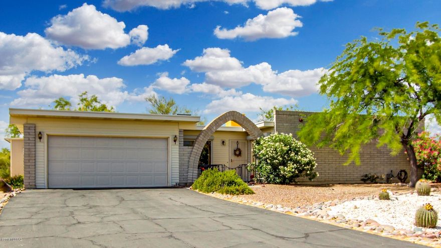 Drive into this quiet neighborhood, close to shopping, dining, hospitals & escape the noise & bustle of the city. Beautiful 4 bdrm 2 ba located on huge 3/4 acre low maintenance lot. Slump block construction w/alum siding accents. 1983 sq ft plus 10 x 10 finished workshop. Tile and wood look laminate flooring in all the right places w/carpets in 3 bdrms. Solid maple cabinets with pullouts & granite countertops, stainless steel appliances in updated eat in kitchen. Whole house water filtration & softener. Crown moulding, solid alderwood doors, ROLLA SHIELD shutter security screens on all windows, keeps the heat out, & your safe  home worry free.  Dual AC. Low maintenance desert landscaping w/ drip system. Renovated throughout. Enjoy quiet star filled nights in your new home