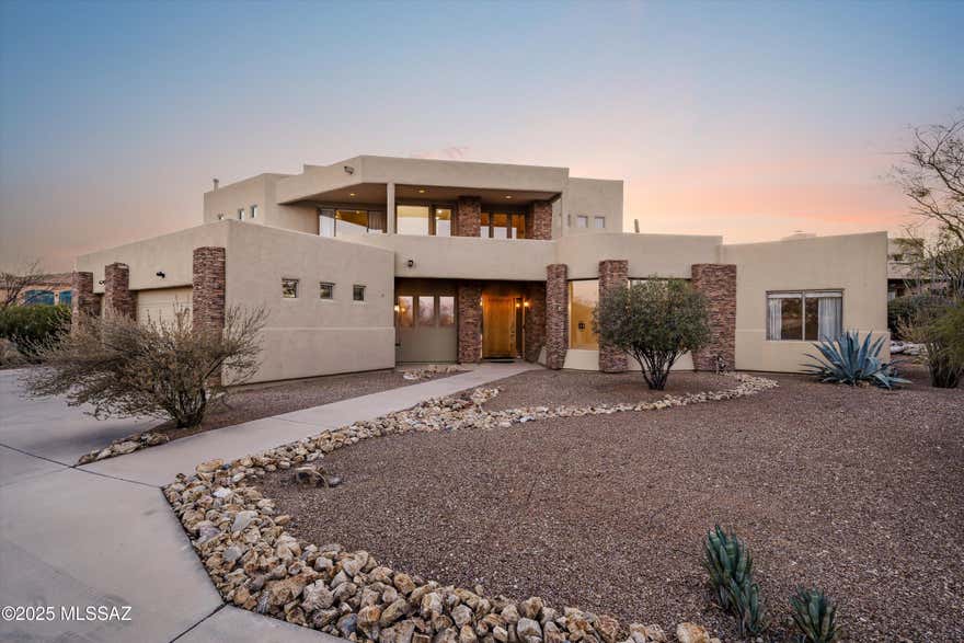 Come experience all the beauty and convenience of Tucson's west side with this two story, 3 bedroom, 3 bath cul de sac property located in Starr Pass. Perfect for entertaining, the living space features soaring 22' ceilings along with a spacious kitchen with ample storage. The loft area has a built in library with office cabinets and access to two balconies just made for stargazing or watching the sun set. Outdoor living space features a freshly replastered heated pool and spa, as well as a gas fireplace and new built in bbq. The roof has just been recoated and the HVAC systems are newer.  This tranquil property features quick and easy access to I-10, Mercado San Augustine, Fox Theater, and downtown dining and entertainment, as well as Tumamoc, Gates Pass and Tucson Mountain Park.