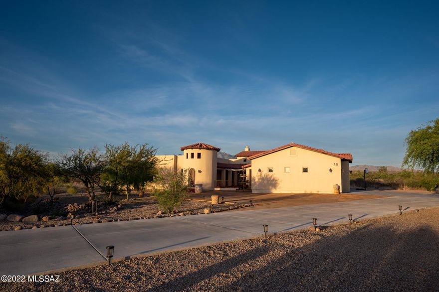 Welcome to 48 Circulo Bautista, located in the highly sought after gated community of Tubac Rio Cruz. This property features and open concept floor plan with over 3,000 sq. ft of living space. Upon entering you will notice the high ceilings, Anderson windows, Viking appliances, custom granite counter tops in the kitchen, wooden plank floors, full bar, fireplace, and view of the resort style back yard. All 3 bedrooms are spacious with their own full bathroom. The Master bedroom has a large walk-in closet, and steam shower to relax after a work out. The extended 3 car garage has plenty of space for full size vehicles, work station, and storage with the overhead garage racks. The salt water pool is perfect to enjoy with your family, or view the amazing sunsets. Make your appointment today!