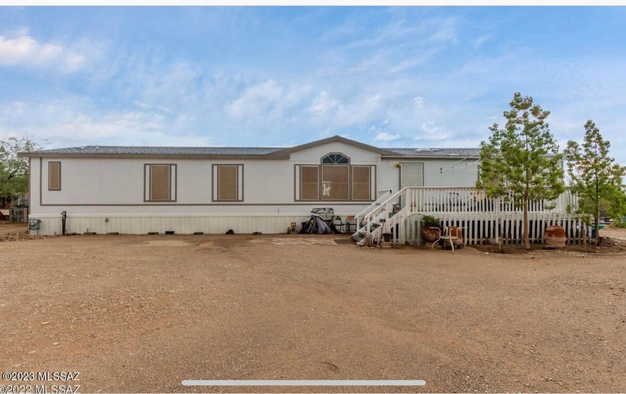 Spacious home with 4 bedrooms, 2 baths and a bonus room on over an acre lot. Bring all your toys, there's plenty of space. Low utilities with solar system. Enjoy the Tucson night skys on your front deck. Hurry, don't let this one slip away.