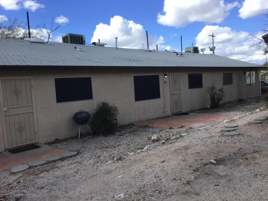 Tri-Plex in Prime Corner Location Just blocks from Downtown Pima College and the Uof A All units have carports Washer Hookups Water & Sewer on Master Meter