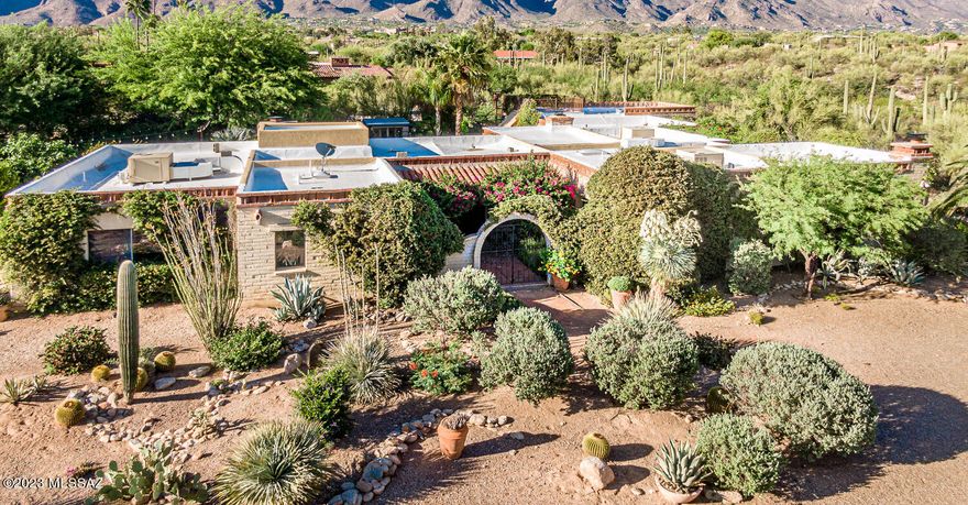 Location, Location, Location, Old Tucson Charm, an Amazing Family home in the Catalina Foothills Estates #5 with plenty of room for all that you want to do. 4 Large Bedrooms, 3.5 Baths, Living Room, Family Room, Office, Playroom, Office/Safe Room and a 3 Car Garage. 3 Fireplaces, Saltillo Tile, A Bright Open Kitchen, Gas Range with a separate Wall Oven/Microwave, Quartz Countertops, too many features to list them all. As nice as this home is, the yard is just as nice, several outside living areas, swimming pool, a huge grass yard (overhead lighting), there is even a roof deck that offers unobstructed views of the sunsets and the city lights. A private vegetable garden with over 20 fruit trees. The flowers in the yard are amazing. A True Family Home.