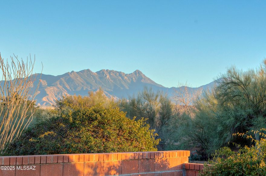Spectacular mountain views, sunrises, and sunsets await you at this Las Campanas home with assumable 2.875% loan! With a prime location, no rear neighbors, and an Arizona room featuring a rare remote control electronic pergola, you can enjoy all weather conditions in comfort. This 1867 sq ft, 2-bedroom, 2-bath home boasts tile flooring throughout. Inside, you'll find a freshly painted interior, a generous family room, dining area, and a great room with a French door leading to the Arizona Room with a hot tub.
The kitchen is enhanced with granite counters, a Bosch refrigerator and dishwasher, a breakfast nook, and a breakfast bar. The spacious primary suite includes dual vanities, a walk-in closet, and a walk-in shower. Guests can enjoy privacy with a pocket door that separates the guest bedroom and bath. Out back, you can relax in the screened-in patio with a hot tub, or work on your golf game on your very own putting green. The beautiful backyard also features grapefruit, lemon, and orange trees. For those who like to work in the garage, there's an added screen door for light and fresh air, along with a mini-split system for those hot Arizona days.
Schedule your showing for this move-in ready home today!