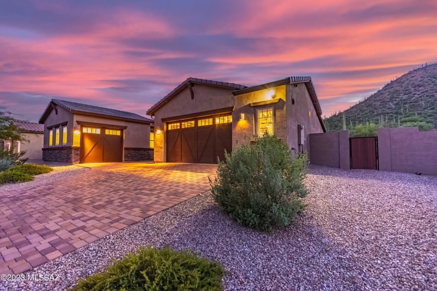 Rare opportunity to own arguably the best lot in the Gated Star Pass Vistas. The Sellers spared no expense making this Lennar-built home featuring 5 bedroom 3 bathroom plan a truly beautiful home. Tons of upgrades including garage extension, lighting at rooftop deck, upgraded kitchen, GE Monogram fridge, hood, dishwasher, beverage fridge, 6-burner oven, pot filler faucet, LED lighting in garage, fireplace in great room, spa shower upgrades, expanded brick pavers in front drive, low maintenance backyard w/artificial turf, sliders to backyard off great room, and much more! Views abound from the front yard to the Catalina Mountains and the backyard to the saguaro-studded hill. Spiral staircase to rooftop deck offers a place to relax when the sun is setting to capture our magnificent sunset.