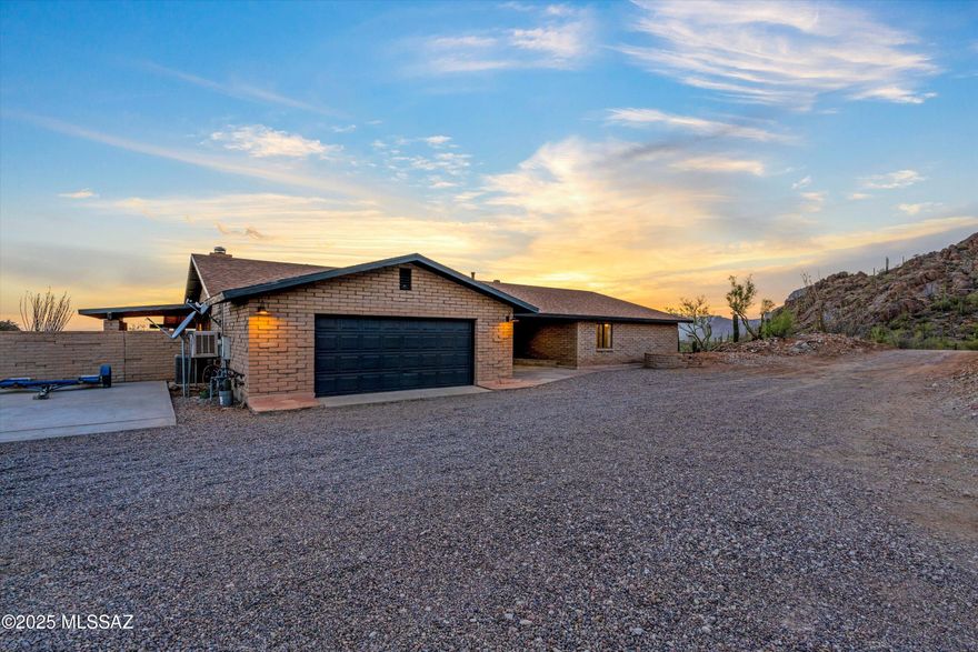 Set upon nearly 3.3 acres of natural desert landscape, this remarkable property offers breathtaking mountain views that greet you at sunrise and bid you farewell at sunset. The energy here is grounded, vibrant, and ready to support its next owner in a life of balance, beauty, and possibility.

Inside, the fully updated home welcomes you with four spacious bedrooms and two beautifully remodeled bathrooms. A brand-new kitchen complete with quartz countertops and modern appliances invites both everyday ease and joyful gatherings. The home is thoughtfully enhanced with smart home integration, central vacuum system, and a whole-house water softening system. Every detail has been carefully refreshed  from new lighting and fixtures, 220v pre-wire in the garage for an EV, to the upgraded HVAC and a brand-new roof under warranty  allowing you to step into effortless living from the moment you arrive.

Step outside and experience the property's true soul: a sparkling pool and spa surrounded by peaceful desert vistas, offering daily renewal under the wide Arizona sky. The additional pool house presents endless opportunity  whether as a future guest house, creative studio, or private retreat.

This is more than a home  it is a sacred space for inspired living, where nature, privacy, and possibility come together in perfect harmony.