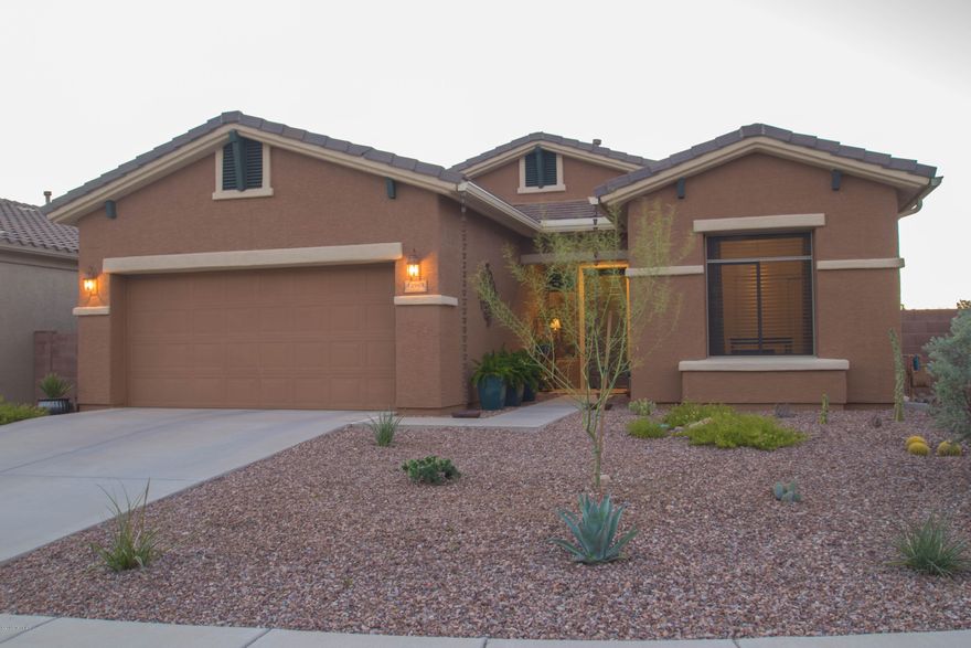 Vistoso Corner Private Lot w/ single story stunning home! Enjoy the Vista View of the Tortolitas and Catalinas and desert wash. Easy access to 27-mile hiking trail. Master walk-in closet w/ ensuite bath, executive height sinks. 10 ft ceilings and upgraded ceiling fans. 17'' porcelain tile. Kitchen w/ grainite, pull-out shelves, soft close, wine cooler, stainless appliances w/2-drawer dishwasher, pantry. Laundry w/ sink, granite and cabinets.Stunning Exterior, painted in 2015. Pebbletec heated pool, gas bbq island w refrigerator.Solar shades on all exterior windows and patio w/ roll-down sunshades to turn patio into all-season room. Eco friendly: new gutters with rain water harvesting. Citrus Trees, 2 car garage with insulated garage doors, and overhead storage. Must see