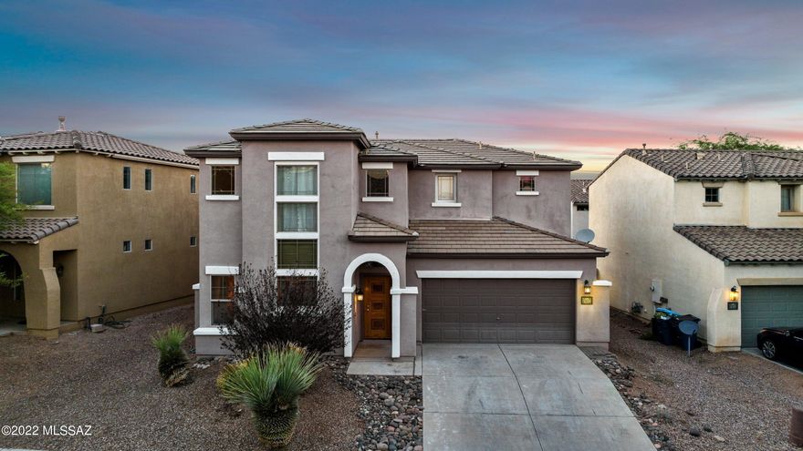 Welcome home to this 2 story home in the desirable Rancho Sahuarita community! This 4 bedroom, 3 bath house boasts high ceilings and wood flooring throughout. Upgraded kitchen with granite counter tops, stylish backsplash, stainless steel appliances and a large, walk in pantry. Downstairs is complete with a bedroom and full bath. Save on the electricity bill with OWNED SOLAR panels. Come see today!