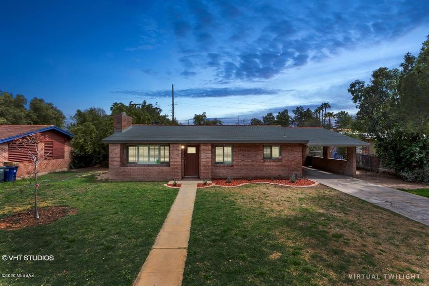 PRICE JUST REDUCED! This is a Fannie Mae HomePath Property! Charming red brick home located in the historic Winterhaven neighborhood, close to shopping, restaurants, Tucson Racquet Club, the river walk, & much more! Enjoy the park like atmosphere & green non-native landscape that lines wide streets. This home has 3 bedrooms, 2 bathrooms, family room with fireplace, dining area, laundry room, & large backyard with covered patio. Spacious kitchen with breakfast bar, backsplash, under mount sink & quartz counter tops. <FONT COLOR=RED>Recently painted interior with two tone paint, installed new stainless steel kitchen appliances, tile flooring in all the right places & NEW A/C. Bathrooms have NEW vanities, framed mirrors, & beautiful tile shower surrounds.</FONT> Water utility included in $70 monthly HOA dues. Attention First Time Buyers: complete the HomePath Ready Buyer homeownership course. Attach certificate to offer and request up to 3% closing cost assistance. Ask Agent for more details. Restrictions apply.