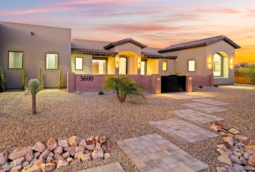 Ready NOW in Gated Colonia del Sol. Stunning New CONTEMPORARY by Simmons Home Designs, Axios Builders and Interior Design  by Architectural Touch, LLC. Perfectly Sighted to capture outstanding Mountain Views. Elegant Design & Superb Finishes. Pella Window Package, featuring 30 Ft Sliding Door System at Great Room. Superb Kitchen Design w/ 48'' Wolf Duel Fuel Range, Sub-Zero Refrigerators, Generous Marble Island & Sophisticated European Style Cabinetry.  Elegant Exterior Design w/ Tumbled Paver Driveway & Silver Travertine Patios/Pool Deck. Heated Pool/Spa, 2 Outdoor Firepits & Spacious Covered Patio.  Stunning Great Room  w/ Vertical Wood Accent Wall & Sleek  72'' Linear Gas Fireplace. Luxurious Primary Suite w/ Oversized Walk-in Closet. 2 En-Suite Guest Bedrooms & Stunning Home Office.