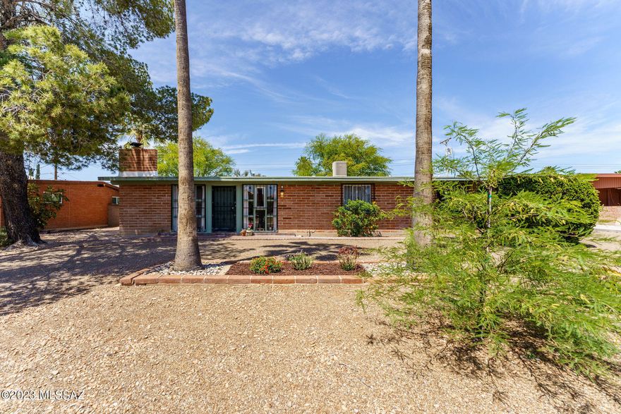 A rare opportunity in central Tucson, this 3 bedroom, 2 bathroom mid-century charmer with detached 1 bedroom, 1 bathroom guest house has been wonderfully maintained and cared for. The main house features a bright and open floor plan with tongue in groove ceilings, wood flooring throughout most of the home, kitchen with wood cabinets and island, and two living rooms, The guest house boasts a completely remodeled bathroom, full kitchen with island, separate living area and bedroom, new roof, mini split, separate fenced off backyard, and patio with a private entrance and parking. Close to restaurants, shopping, and schools, this one won't last!