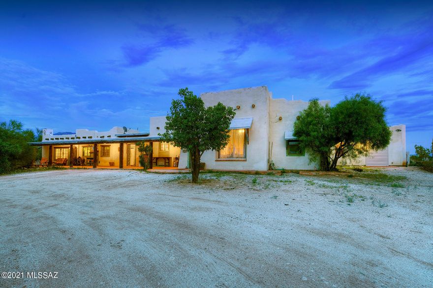 VIEWS, VIEWS, VIEWS just minutes away from the RINCON MOUNTAIN VISITOR CENTER! STUNNING Custom Built 4 Bedroom, 3 Bath, CLASSIC Santa Fe NESTLED on a PRIVATE, OVERSIZED PREMIUM 3.4 Acre lot and SURROUNDED by Plenty of NATURAL Desert Vegetation. You'll find INCREDIBLE Mountain and City VIEWS and PLENTY of Room to Roam so Bring your HORSES! Dramatic Gourmet Cook's Kitchen featuring Stainless Steel Appliances, Granite Countertops, and Adjacent to BOTH Living and Family Rooms. You'll find a SPLIT Open Floor-Plan with LOTS of Mexican Concrete and Ceramic Tile. Large GUEST HOUSE that can be used to generate rental income.  Large BONUS/Music Room.  Absolutely FANTASTIC Location and a Very PRIVATE Setting are PERFECT for Living and Entertaining. Welcome Home!!!