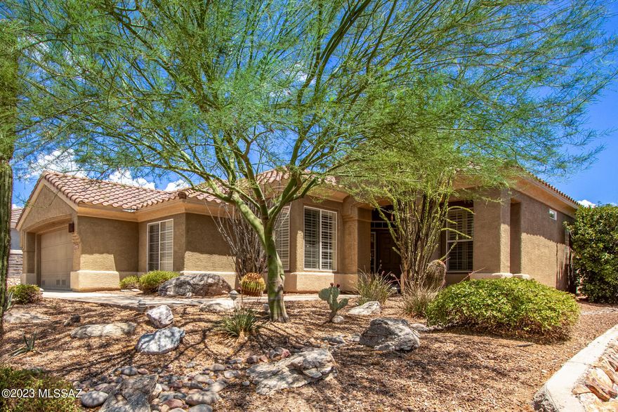 Well appointed Whetstone/Tahoe model. Tranquil backyard oasis with extensive flagstone patio, multiple sitting areas, gas fireplace, BBQ, sweeping panoramic views of mountains, 17th tee box, ,Arthurs Hill, city lights and glowing sunrises. Plantation shutters throughout and 2 large skylights in the living room  allowing natural sunlight to light up the house!   Kitchen is an entertainer's delight with double ovens, SS appliances, garden sink, gas cooktop, under counter lighting, cabinets galore, pendant lighting, and marble countertops. Sprawling Primary  bedroom including a private retreat area    with  built in  entertainment  center.  Generous sized 2nd bedroom with  bay window. Large formal dining room for  your entertaining pleasure.  Roof replaced 2021, New a/c 2022. Many wonderful  features set this home apart from the rest! Eat in Kitchen with bay window, Oversized  family room. Remodeled Master bath has a walk -in shower and vanity with  dual sinks. Central vac, water softener and so much more.    Abundant storage throughout the home with additional attic space in garage,  garage cabinets and storage, utility room with desk, and  loads of cabinets. Most furnishings are available too!  This is a home you will not want to miss in the premiere gated active adult community. Highlands at Dove Mountain!  Resort style living including golf, tennis, pickleball, fitness center,  restaurant and bar, many clubs and activities and so much more. Down the road form the Ritz Carlton Dove Mountain and near many biking and hiking trails.  Call for your private showing.
